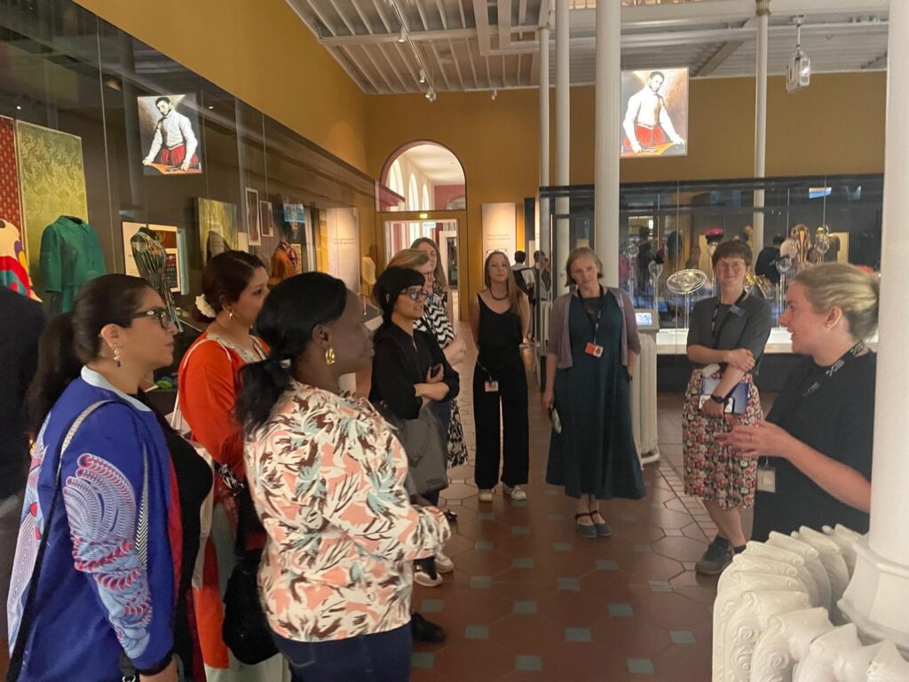 Photograph of a group of people stood in a gallery