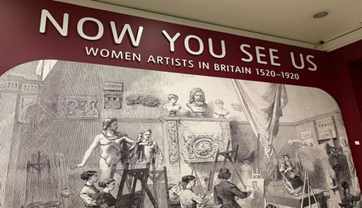 Photograph of exhibition signage reading, "Now you see us: women artists in Britain 1520-1920".