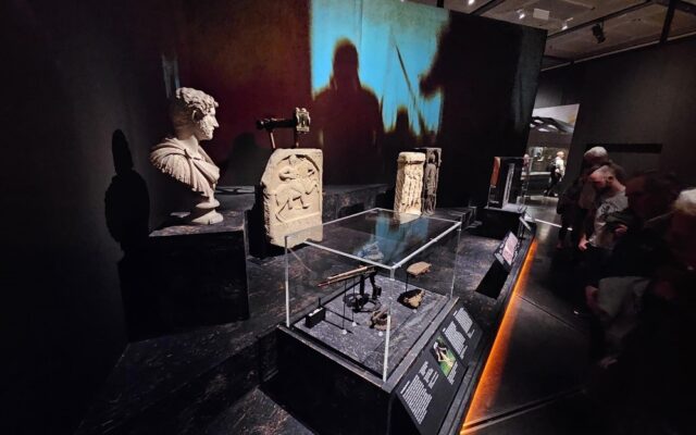 Photograph of stone objects on display in the Legion exhibition