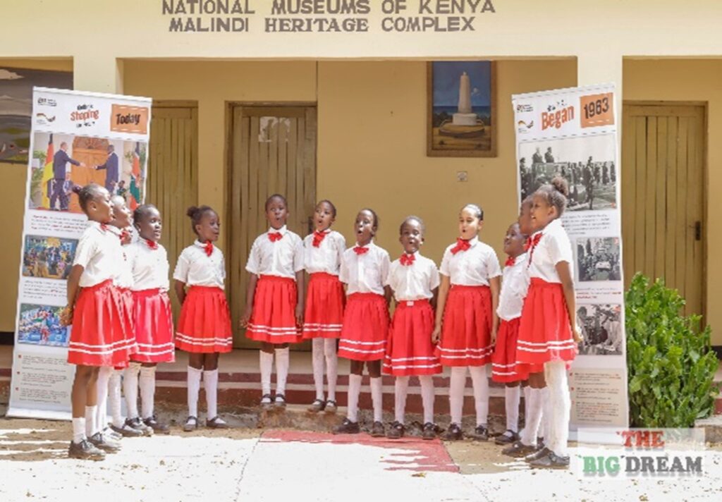 Photograph of children in school uniform stood outside Malindi Museum.