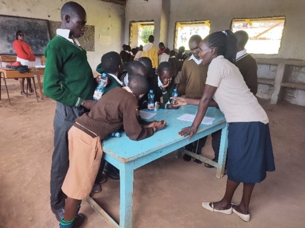 Children looking at objects on a table