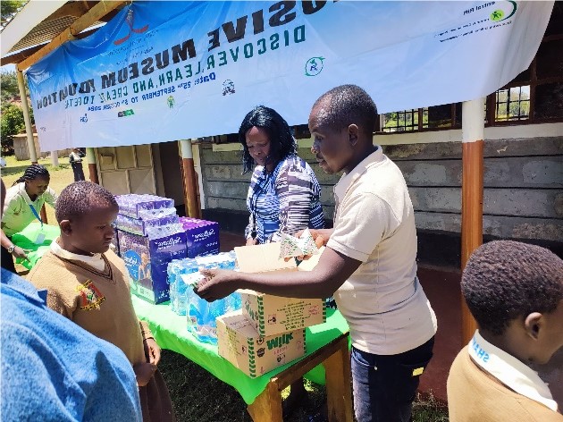 Museum staff with support packages