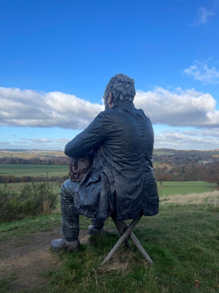 Sculpture of a man on a hillside