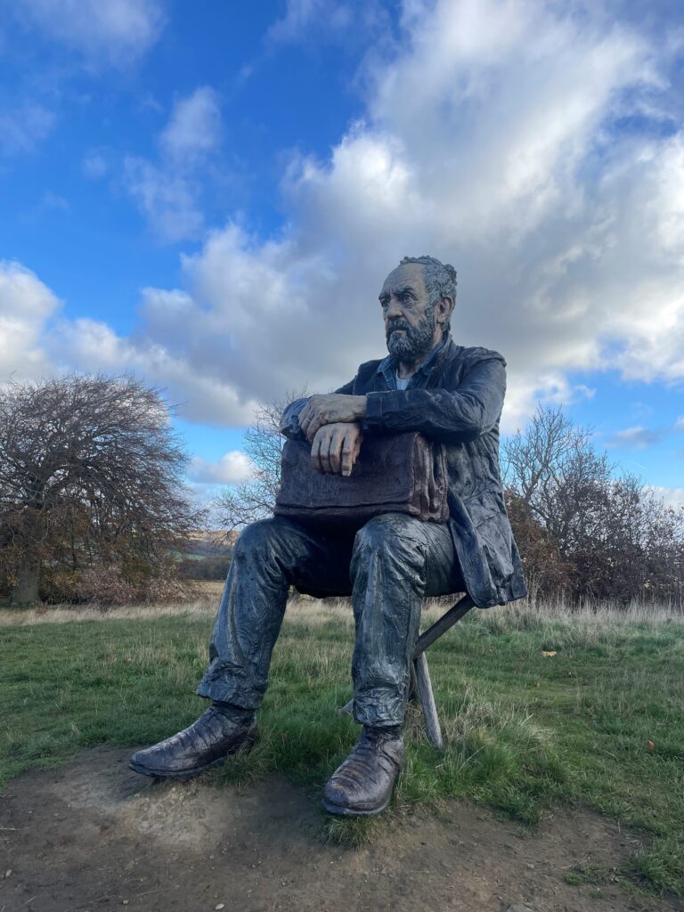 Sculpture of a man on a hillside