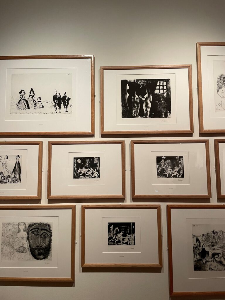 Photograph of a gallery hang of black and white prints