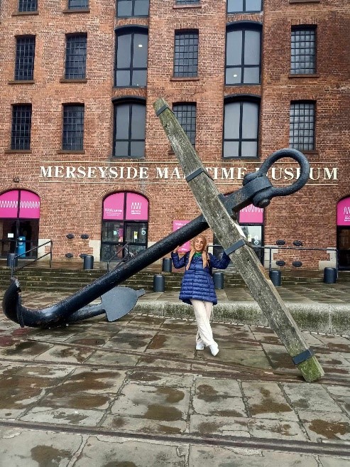 Nagwa stood next to a huge anchor