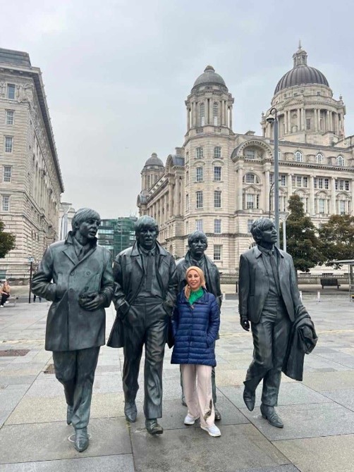 Nagwa stood next to a statue of The Beatles