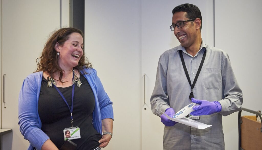 Photograph of a man and a woman smiling.